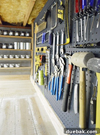 Painted pegboards in the basement workshop