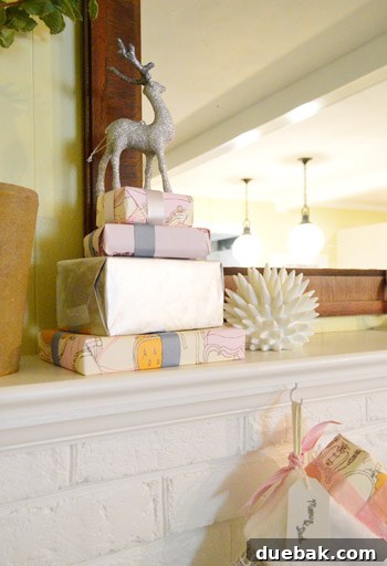 Festive Flair, Simplified 3 Close-up of mantel decor with stockings and glitter stag ornament
