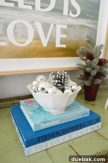 Festive Flair, Simplified 7 Bowl of silver ornaments on books on a console table
