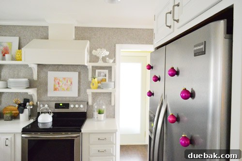 Festive Flair, Simplified 9 Hot pink magnetic ornaments holding cards on a refrigerator