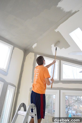 Painting Soaring Vaulted Ceilings: A Master Class 11 Painting a high wall with an extended roller pole