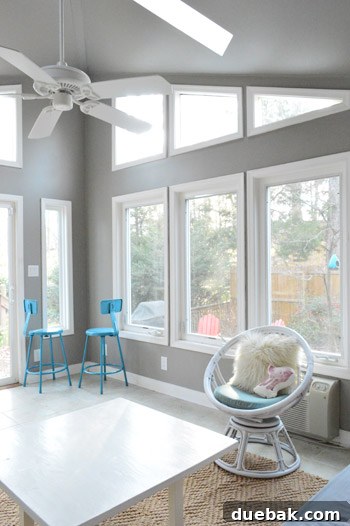 Painting Soaring Vaulted Ceilings: A Master Class 15 Sunroom with newly painted walls and existing furniture