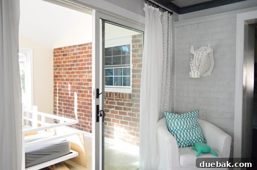 Painting Soaring Vaulted Ceilings: A Master Class 4 Painted brick wall in the living room, visible from the sunroom