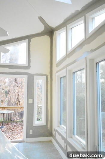 Painting Soaring Vaulted Ceilings: A Master Class 10 Detailed shot of edging around a window near the ceiling