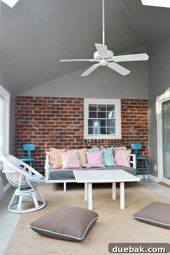Before shot of the sunroom wall, featuring the original, unpainted red brick and its U-shaped profile.