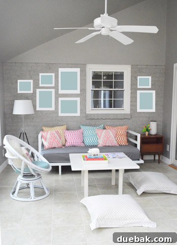Concept art showing how framed pictures might look on the newly painted gray brick wall, creating a focal point.