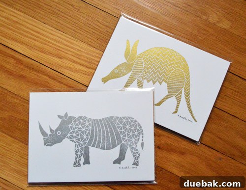 Funnel Cloud Studio gold armadillo and silver rhino art prints for home decor