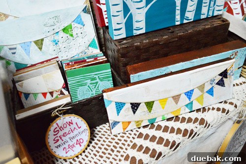 Found Studio small painting with a pennant banner and green bicycle, ideal for accent decor