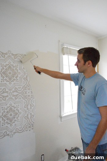 Newly painted wall in a soft, warm tan neutral color, ready for decor