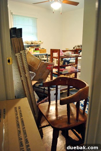 Cluttered playroom filled with miscellaneous items and junk