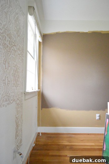 Another view of the playroom walls showcasing various painted sections and colors