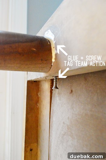 Thrifted Dresser Reimagined as a Media Console 9 Detailed shot of wood glue being carefully worked into a furniture joint with a paperclip, prior to wiping away excess.