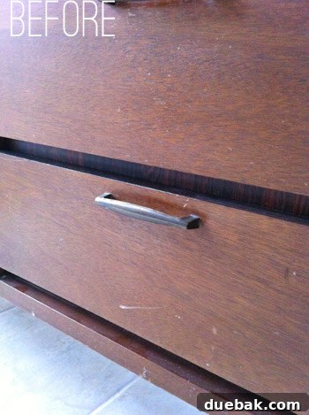Close-up of dirty and scratched wood on the dresser before cleaning