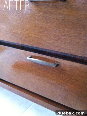 Close-up of cleaned wood after Magic Eraser treatment, revealing original finish