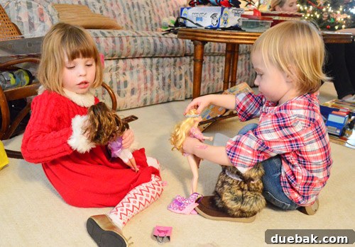 Clara and her cousin Elsa sharing a joyful moment during Christmas celebrations