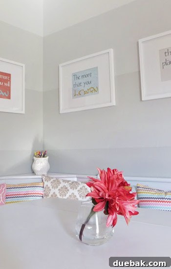 Dr. Seuss quote prints in white frames on the ombre wall