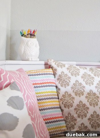 Completed breakfast nook with L-shaped bench, ombre wall, and Dr. Seuss prints