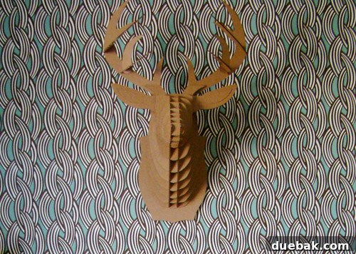 Wallpaper Wonders: A Big Boy's Stylish Sanctuary 6 A playful detail in the big boy room, possibly showing the deer head or other personalized decor