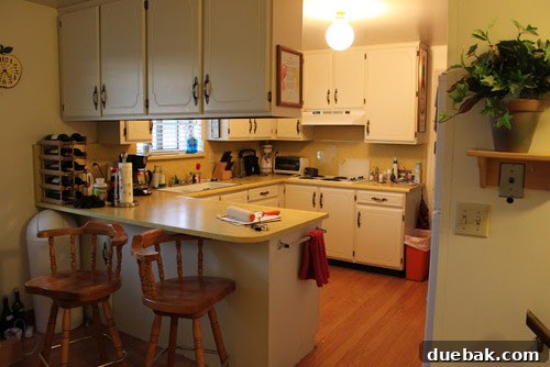 Renovated kitchen after transformation, showcasing new cabinetry and layout