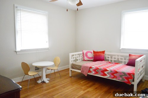 A wider shot of Clara's room, showing the daybed on the far wall and providing context for the dresser's placement.
