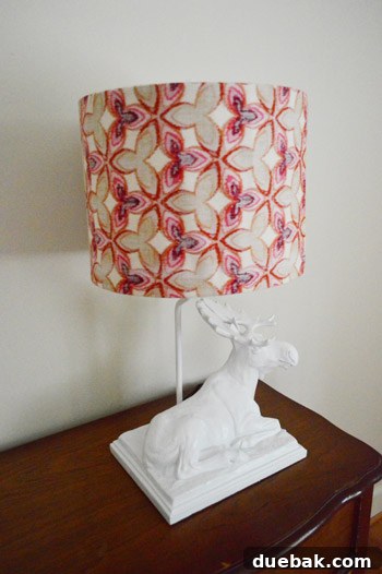 Close-up of the DIY fabric-covered lampshade on the moose lamp, highlighting the texture and muted color from using the fabric's reverse side.