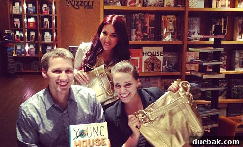 Sherry with Nicholl and her gold purse at the Miami signing