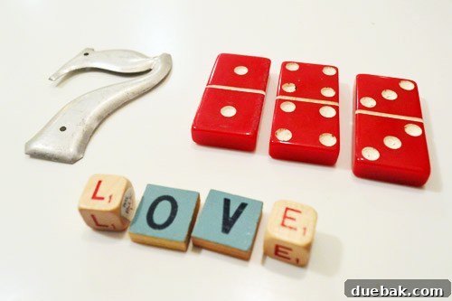 Vintage items purchased at Uncommon Objects: tin 7, dominoes, and letter tiles spelling LOVE