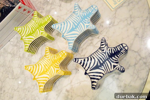 Collection of small faux zebra dishes in various vibrant colors, ideal for nightstands or decorative accents.