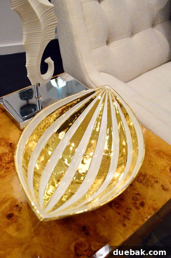 Decorative plate with intricate gold accents, inspiring a DIY project for upcycling thrift store finds.