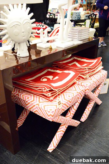 Colorful ikat-style ottomans in a playful mix of white, pink, and bold red, perfect for a child's room.