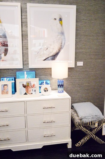 Second large bird art print displayed in a showroom, reinforcing a cohesive and thematic design choice.