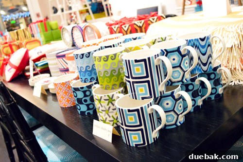 Collection of Jonathan Adler mugs with unique graphic designs and vibrant patterns, ideal for kitchen styling.