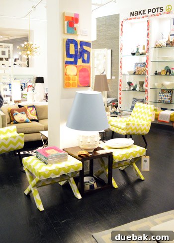 Pair of striking yellow and white patterned ottomans, adding a pop of cheerful color to a living space.