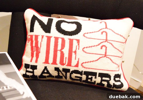 Decorative pillow featuring a humorous and witty quote, a playful addition to modern home decor.
