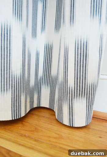 DIY No Sew Ikat Curtains for Playful Kids Spaces 12 Clara's room with the new navy and white curtains hung, showcasing the daybed and a rug