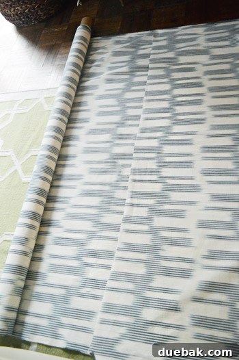 DIY No Sew Ikat Curtains for Playful Kids Spaces 7 Several neatly folded and cut fabric panels lying on top of each other