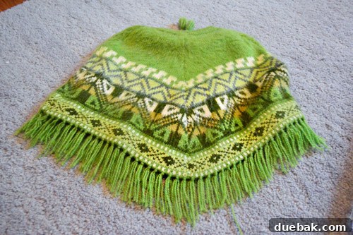 Vibrant handmade Peruvian poncho with intricate patterns