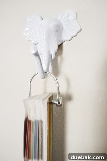Elephant-shaped hook named Manna holding a necklace