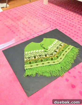 Acrylic frame with its back, showing the charcoal paper background