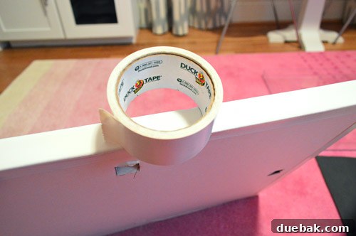 White duct tape applied to the sides of the frame for a clean finish