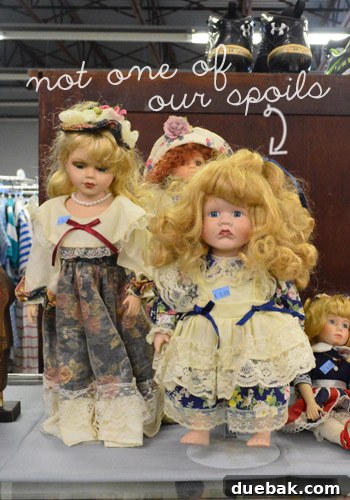A collection of eclectic thrift store finds, including home decor and fashion items, arranged for display.