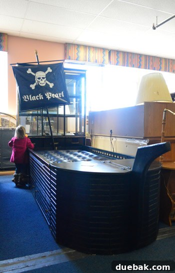 Macklemore's Thrifty Style Showdown 11 A humorous photo of a person reacting excitedly to a pirate ship bed in a thrift store