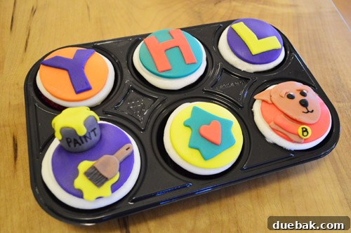 Personalized cupcakes from Undercover Cupcake, featuring the authors and their dog Burger.