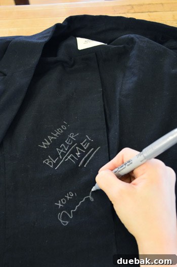 The authors signing the inside of a fan's black blazer, a nod to Sherry's tour 'uniform'.