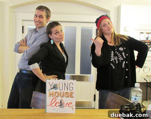 The authors posing with Katy in a humorous 80s sitcom style photo, Katy playing a 'wacky neighbor'.
