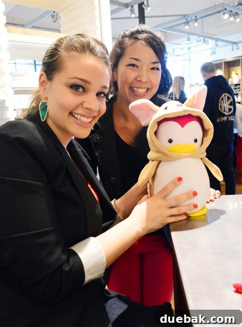 A stuffed penguin toy dressed in a Burger costume, a handmade gift from Akiyo for Clara.