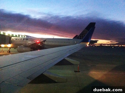 A sunrise view from an airplane window, capturing the early morning flight back home.