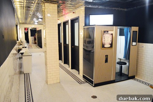 Swapping the Apple for the Peach 15 Interior of a unique unisex restroom featuring a photobooth