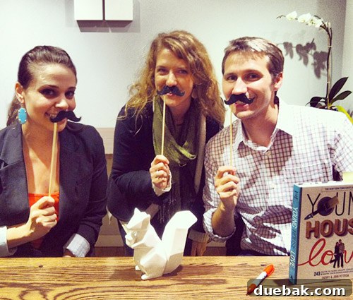 Swapping the Apple for the Peach 6 John and Sherry posing with a fan and paper mustaches for a funny photo