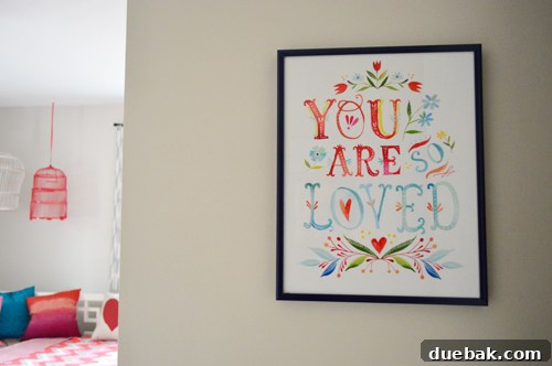 A closer view of the Katie Daisy print, highlighting the text and colorful details.